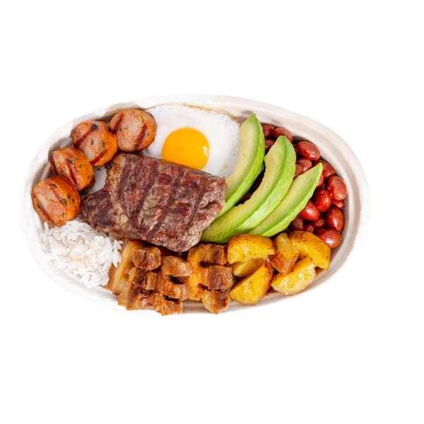 Bandeja Paisa with grilled steak, sausage, fried egg, avocado, beans, rice, and plantains.
