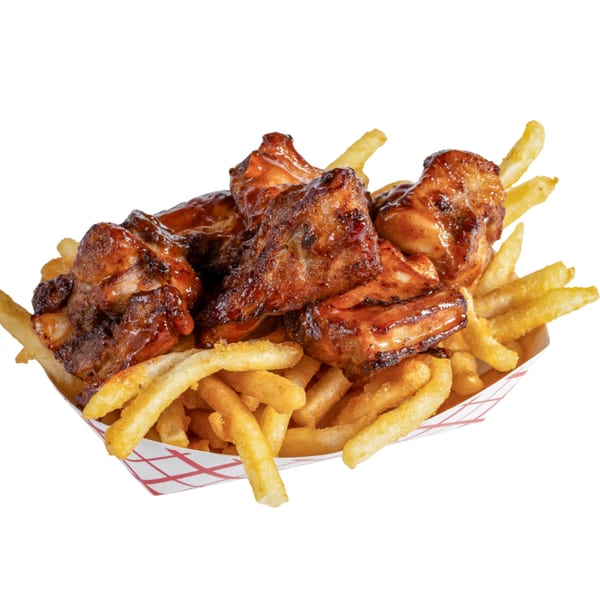 A Banana King fast-food basket filled with crispy french fries and glazed barbecue chicken wings.