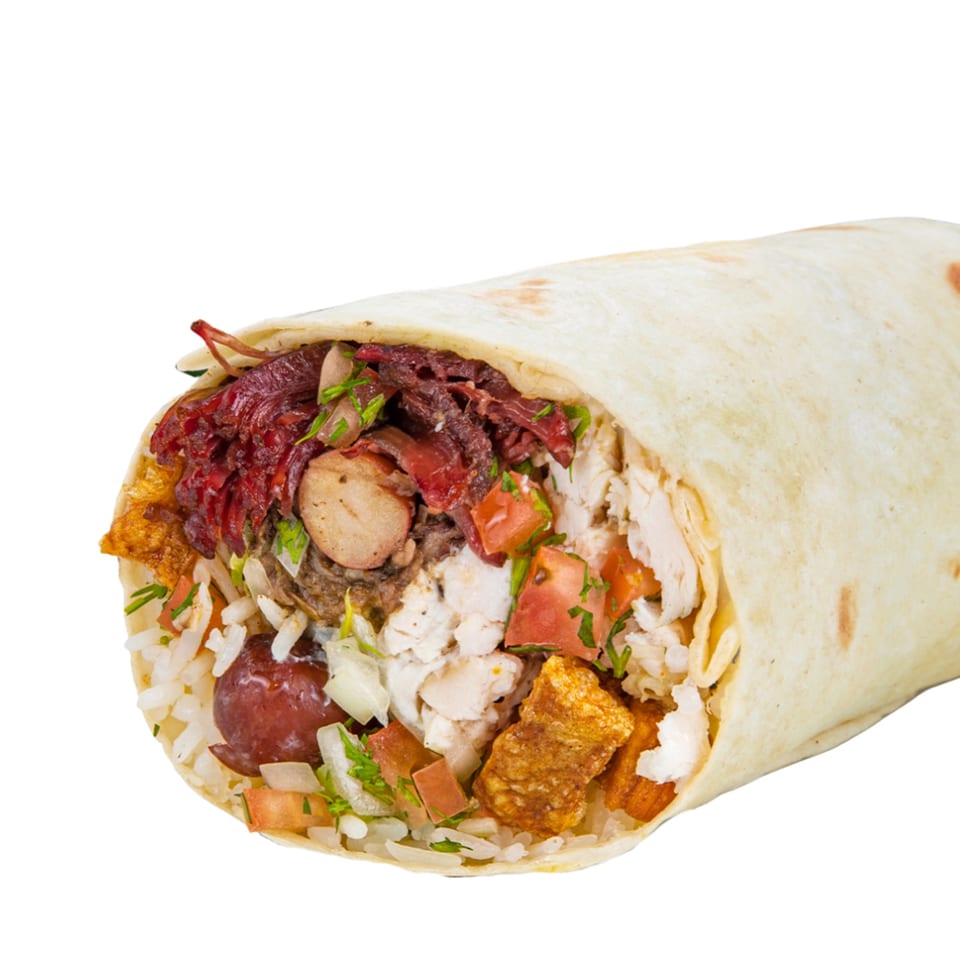 Close-up of a large burrito, revealing a filling of rice, beans, meat, and vegetables.
