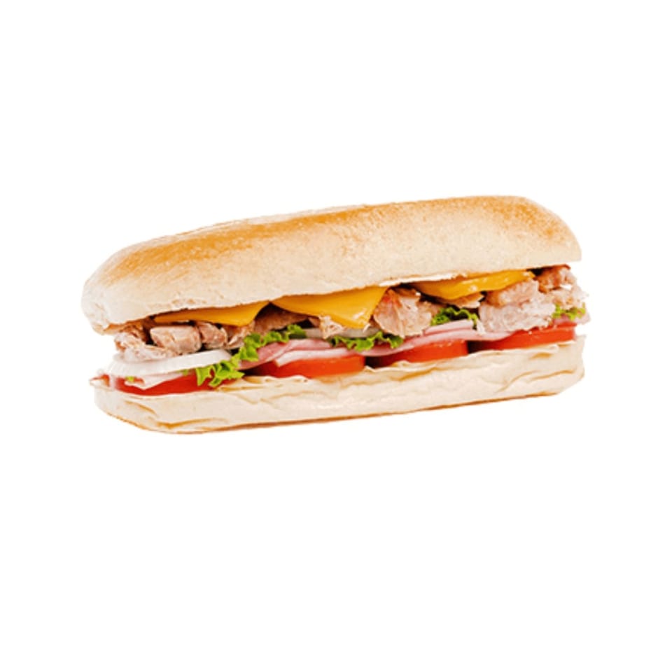 A Banana King sub sandwich filled with meat, cheese, lettuce, tomatoes, and onions.