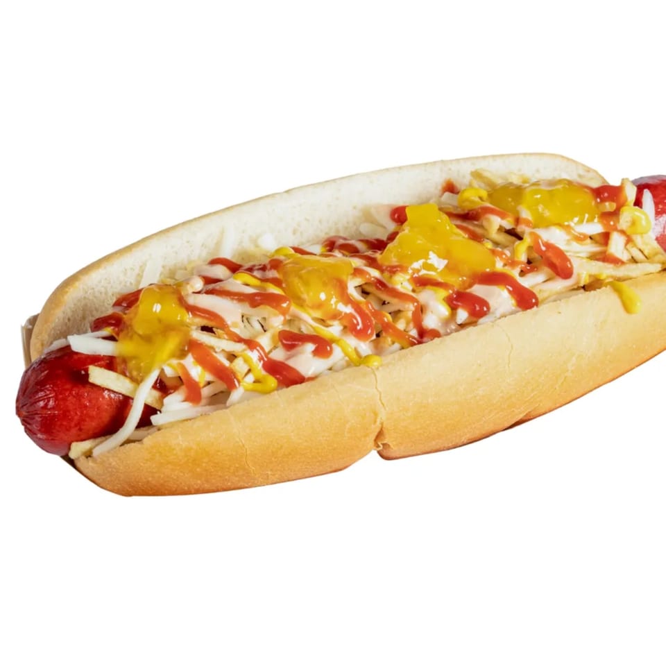 A Banana King hot dog with ketchup, mustard, mayonnaise, onions, and potato sticks.