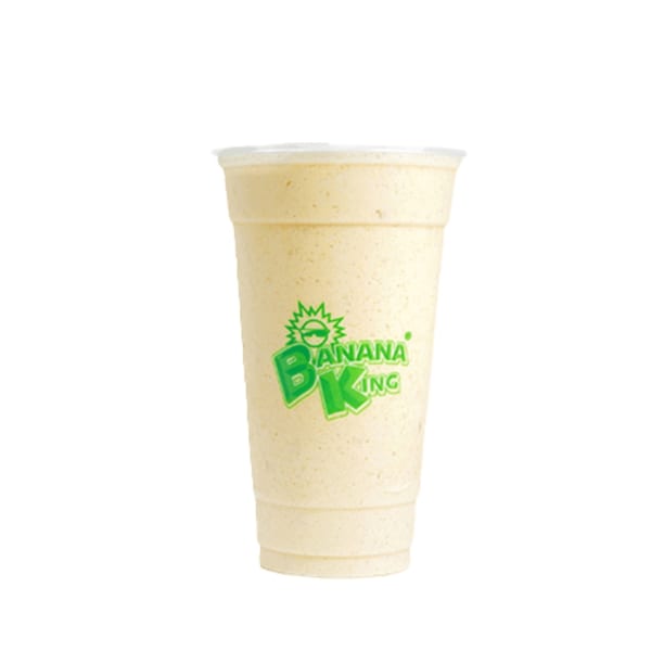 A Banana King banana smoothie in a clear plastic cup with a green logo.